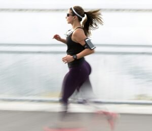 woman running wearing armband