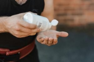 A Person Holding a Bottle. liquid chalk review