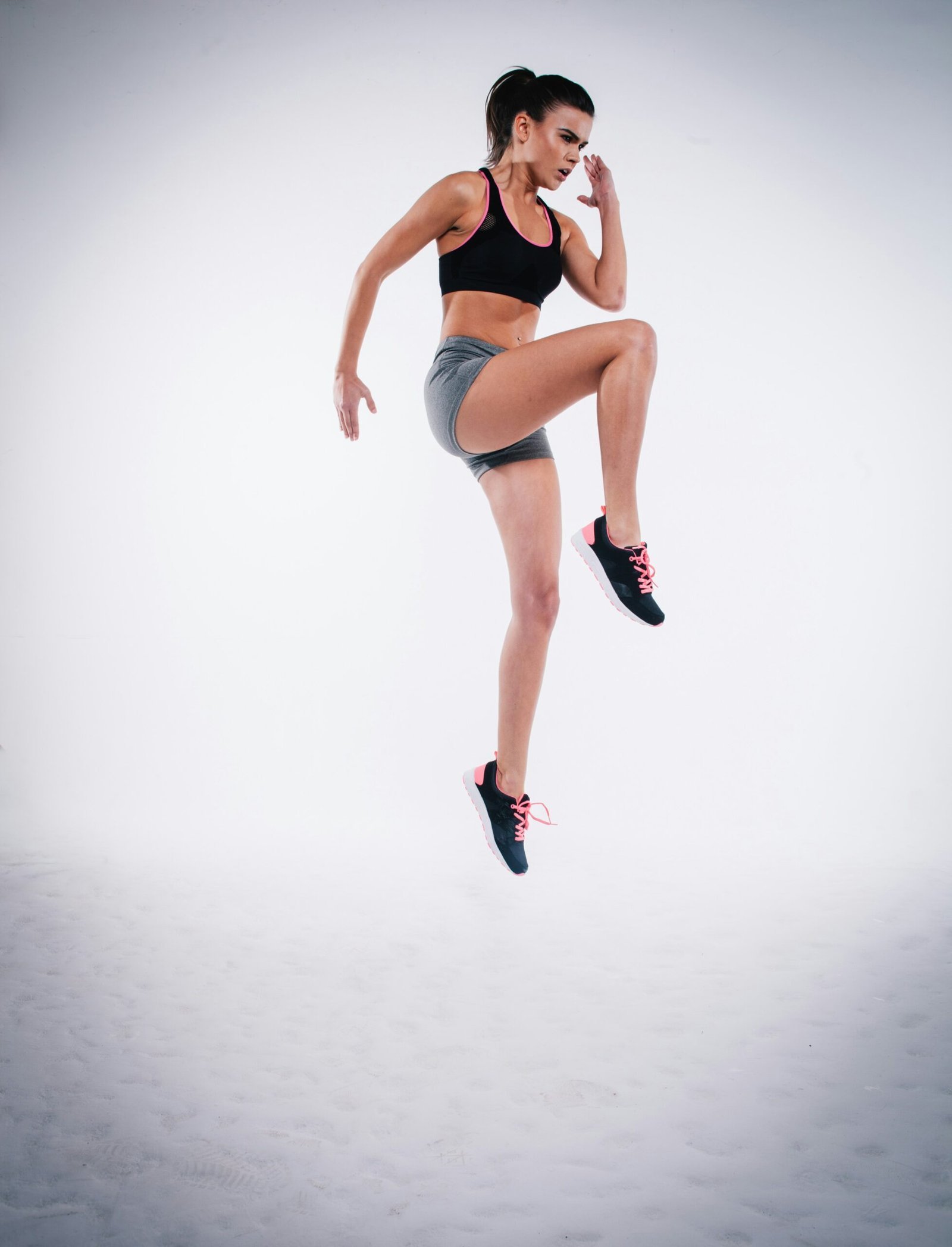 woman jumping near white wall paint.
Cardio Zones