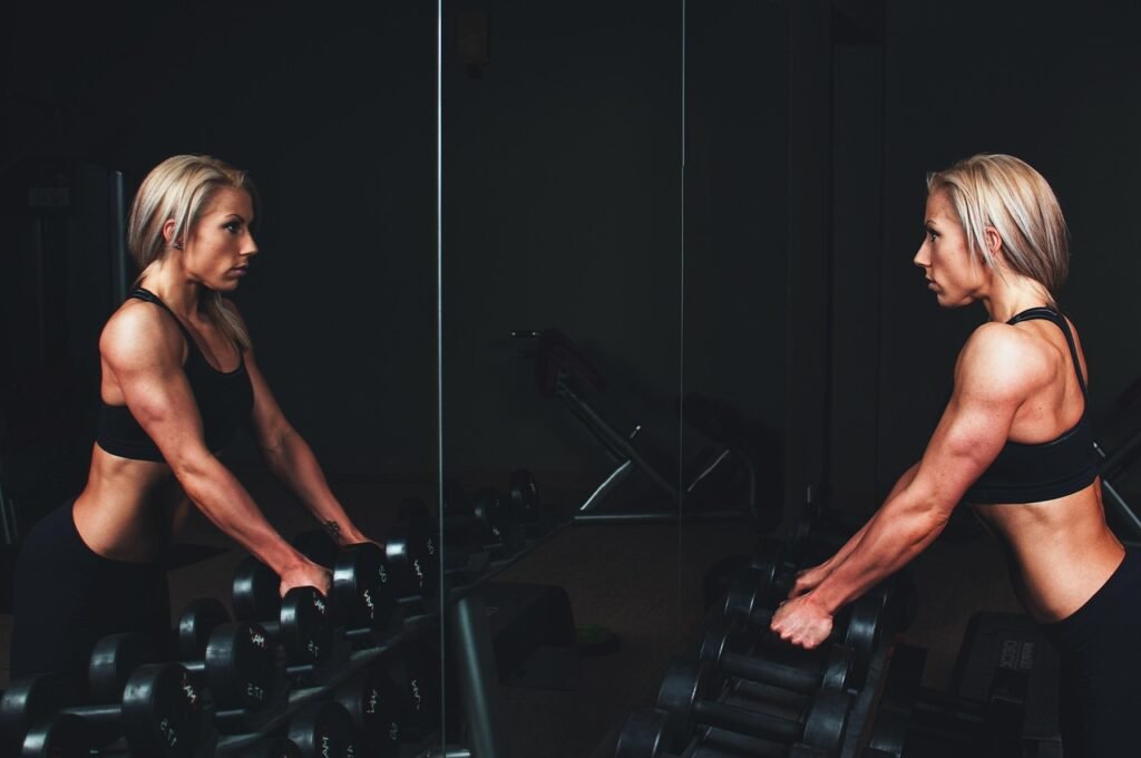 training, muscles, arms, blonde, bar bells, workout, fitness, exercise, sport, gym, strong, young, woman, person, healthy, lifestyle, body, fit, muscular, studio, athlete, equipment, strength, female, active, power, mirror, blue fitness, blue gym, blue exercise, blue training, blue healthy, blue workout, blue sports, blue body, blue mirror, blue power, fitness, gym, gym, gym, how to train around minor injuries without losing progress