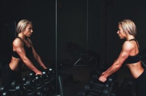 training, muscles, arms, blonde, bar bells, workout, fitness, exercise, sport, gym, strong, young, woman, person, healthy, lifestyle, body, fit, muscular, studio, athlete, equipment, strength, female, active, power, mirror, blue fitness, blue gym, blue exercise, blue training, blue healthy, blue workout, blue sports, blue body, blue mirror, blue power, fitness, gym, gym, gym, gym, gym, mirror